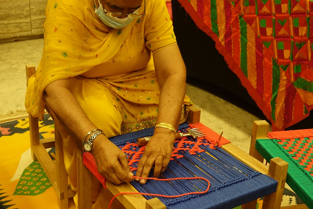 Weaving of Pirri (stool) by representative from Sunehri Saheliyan. Photo courtesy: IHC