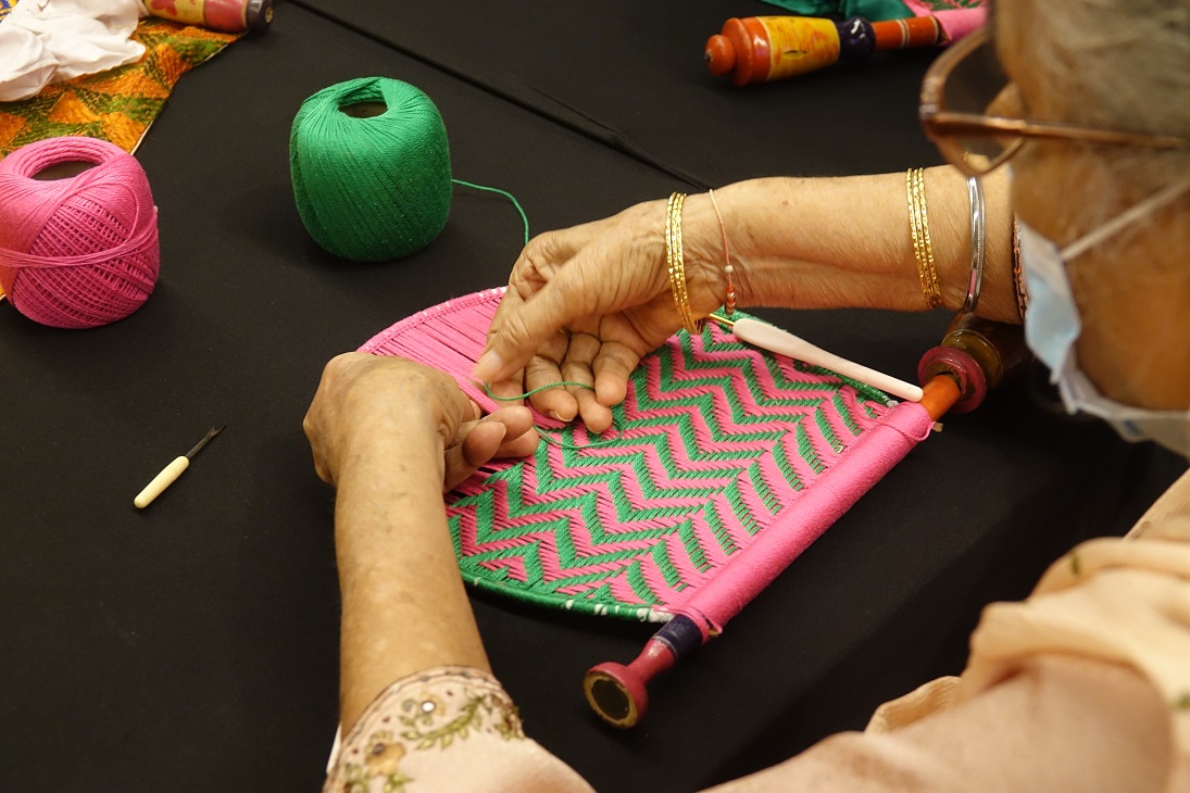 Weaving of Pakkhi (hand fan) by representative from Sunehri Saheliyan. Photo courtesy: IHC