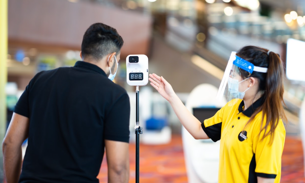 Temperature screening is conducted prior to boarding for passengers.​