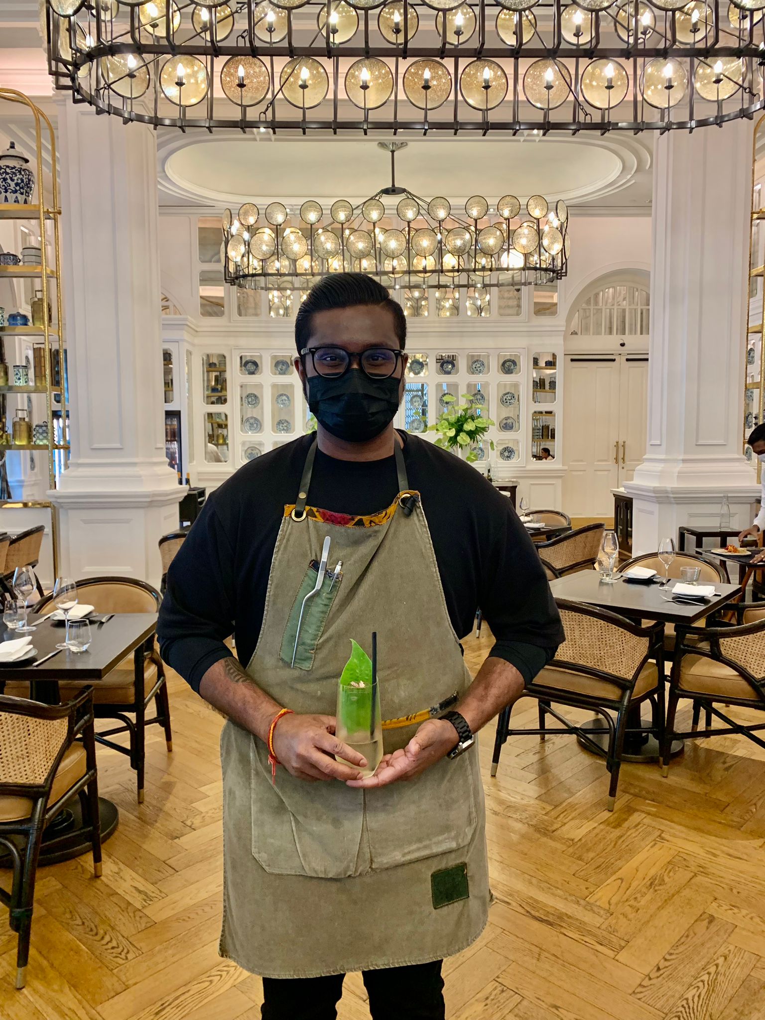 Elephant Room bartender Jeeivan with a Race Course Plantation, a flavourful rum-based cocktail inspired by Singapore's Little India