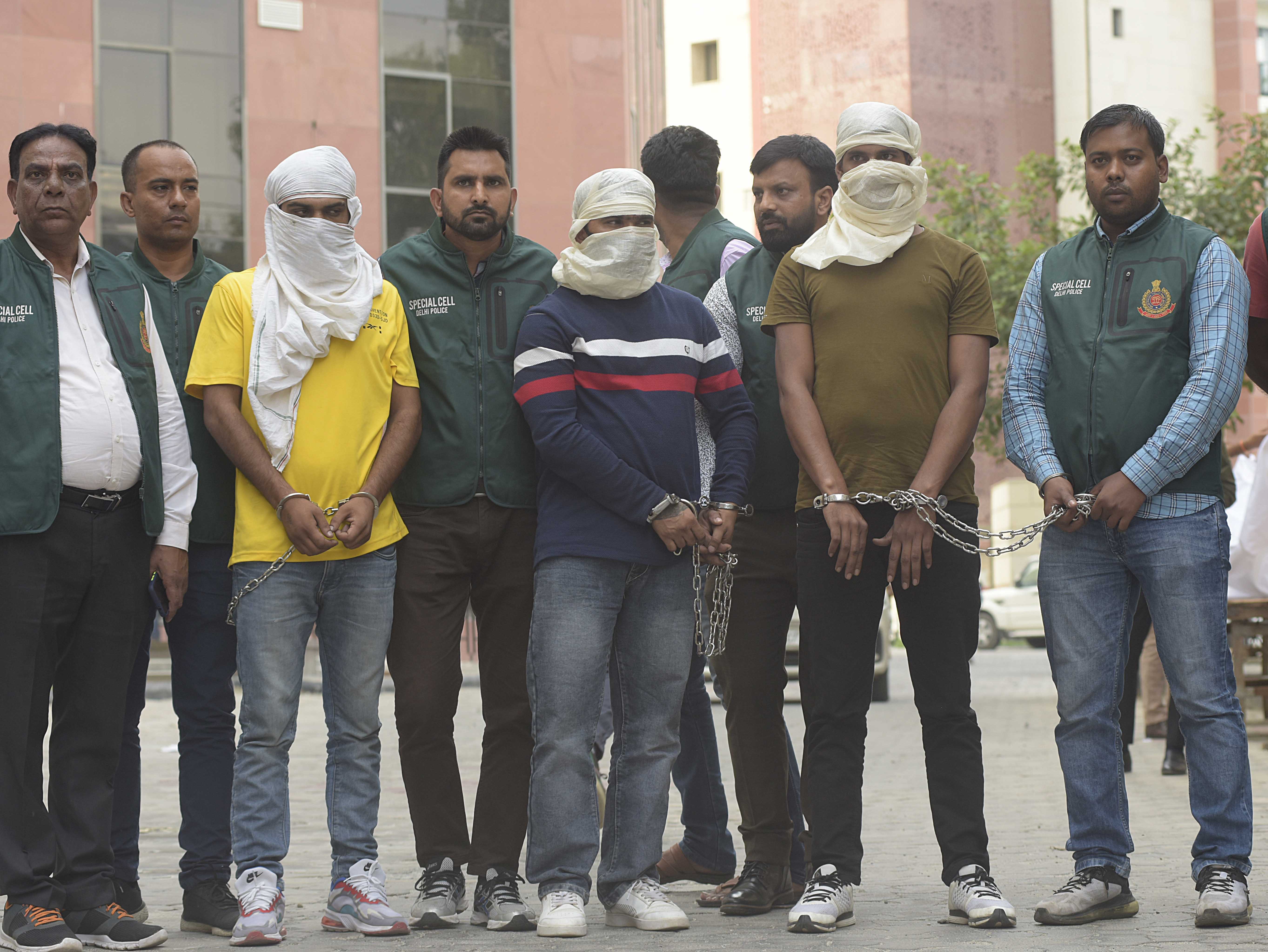 Delhi police Special Cell Security personnel with three persons including two main shooters arrested by Delhi Police Special Cell in the Sidhu Moose Wala murder case, at inside the Delhi Police Headquarters in New Delhi India