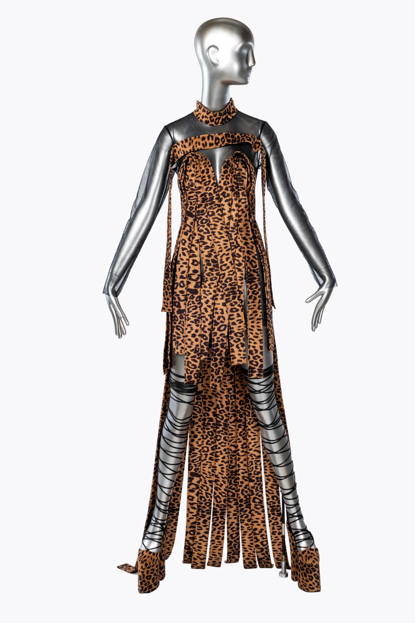 This piece by Harry Halim is from the Spring/Summer 2022 SEDUCE&DESTROY collection which debuted in Paris. It embodies the opposing forces of seduction and destruction. For this collection, the designer destroys the normalcy of the fashion garment to recreate the look by exploring outside traditional tailoring.