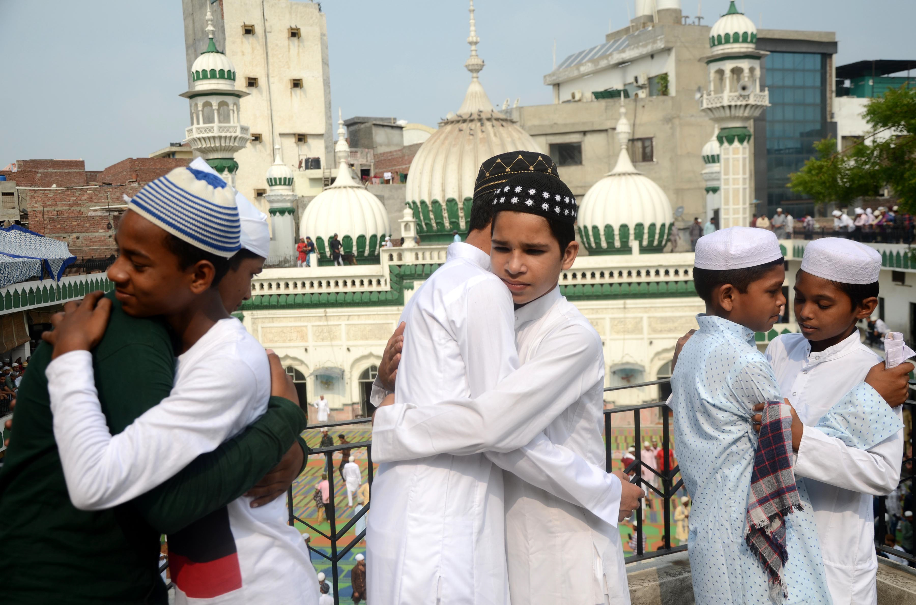Eid Al Adha celebration in Amritsar: Muslim devotees Muslim boys hug each other after offering prayers.