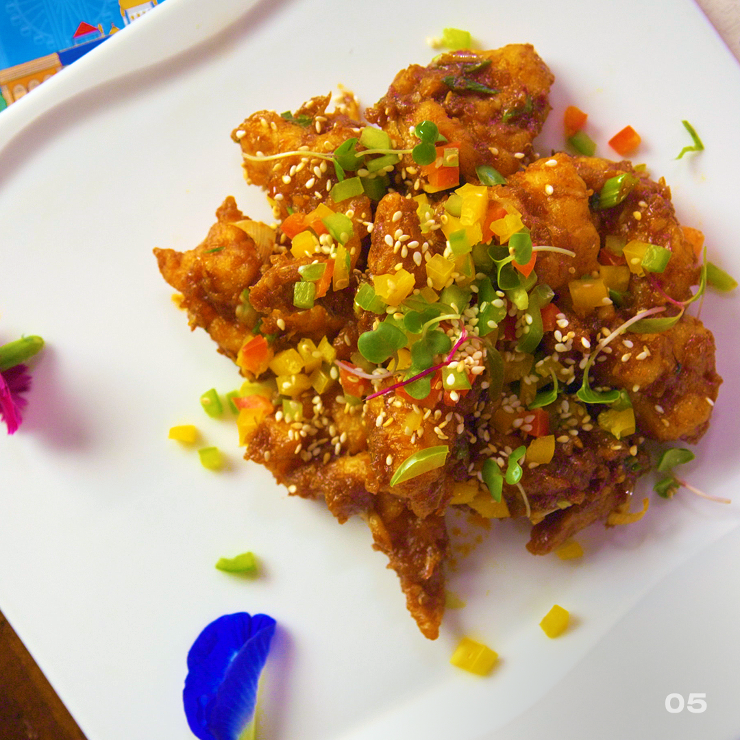 Experience char kway teow (dark soy fried rice noodles) Singaporean delight at Singapore Food Festival, DLF Mall Delhi.