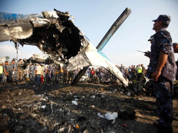 The plane caught fire as it crashed, and rescue workers were trying to put it out, a local official was quoted as saying.