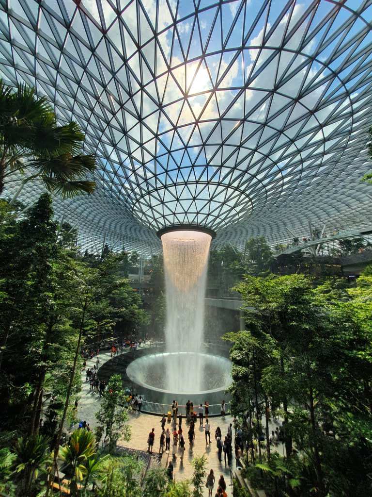 Terminal 1 is immediately connected to the 10-storey shopping complex Jewel Changi Airport, which features seven themed gardens, and a forest valley with over 2,000 trees. 