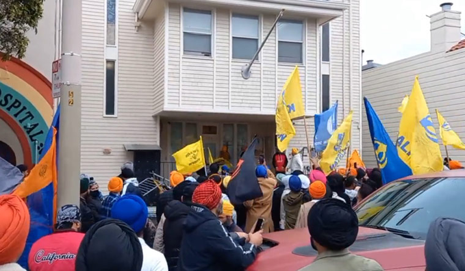 a group of angry protesters entered the consulate premises and started smashing the door and windows with iron rods.