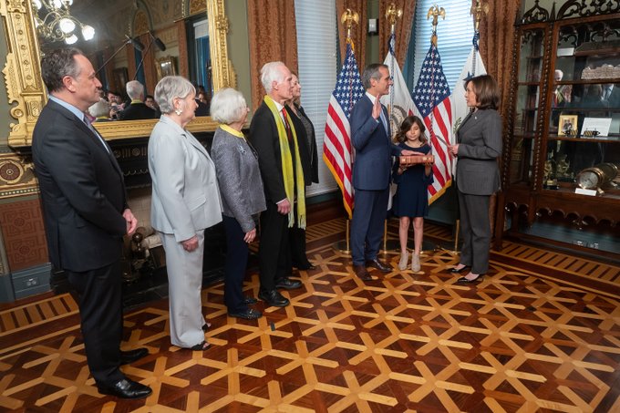 Garcetti raised his right hand while Harris performed the ceremony.