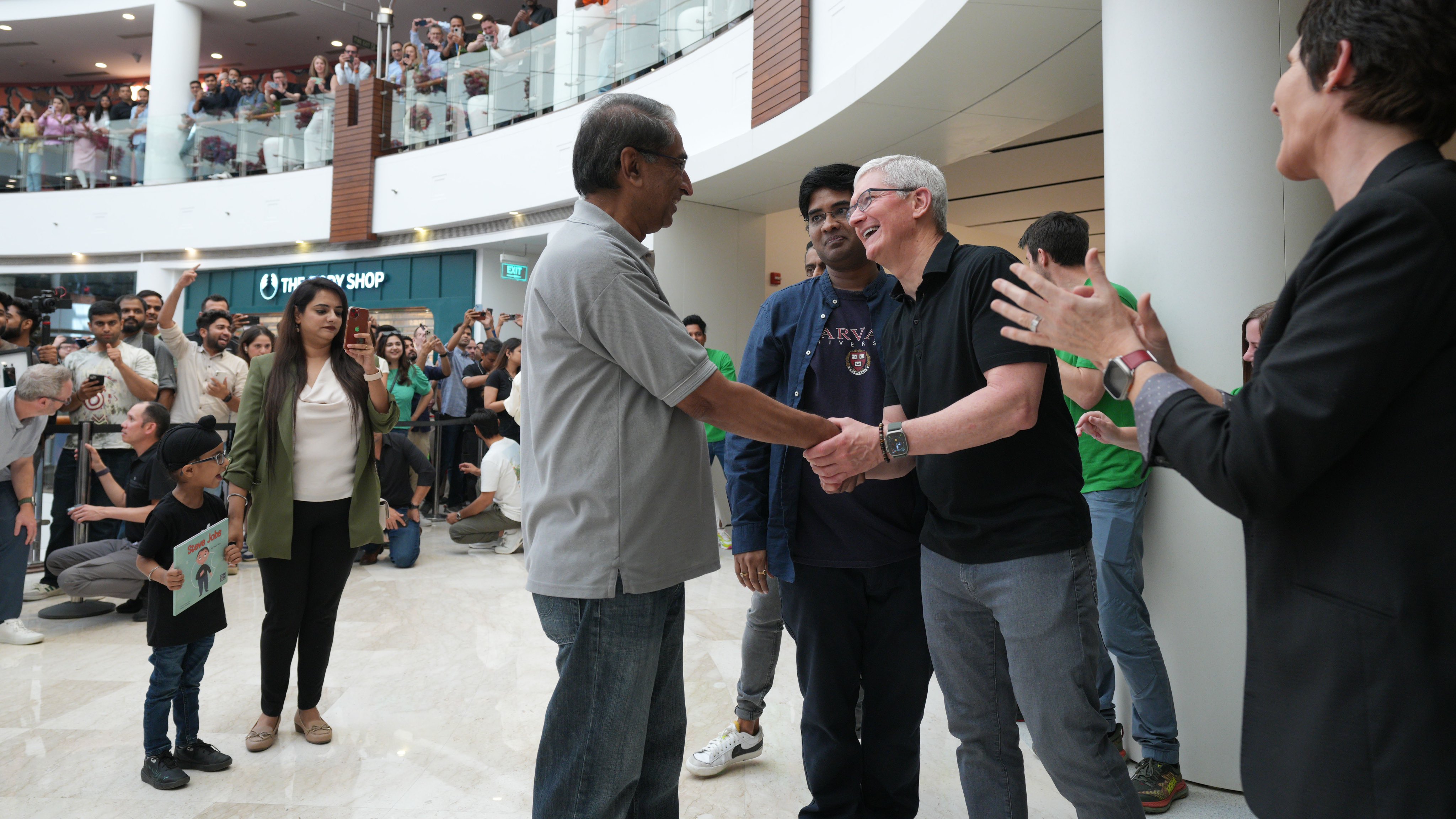 Cook joined the host of Apple retail team members in a countdown before interacting with the first few customers allowed into the store at the stroke of 10.