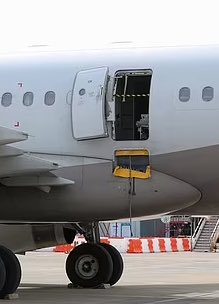 When the plane was still about 200 meters (650 feet) above the ground, a passenger sitting near the emergency exit 