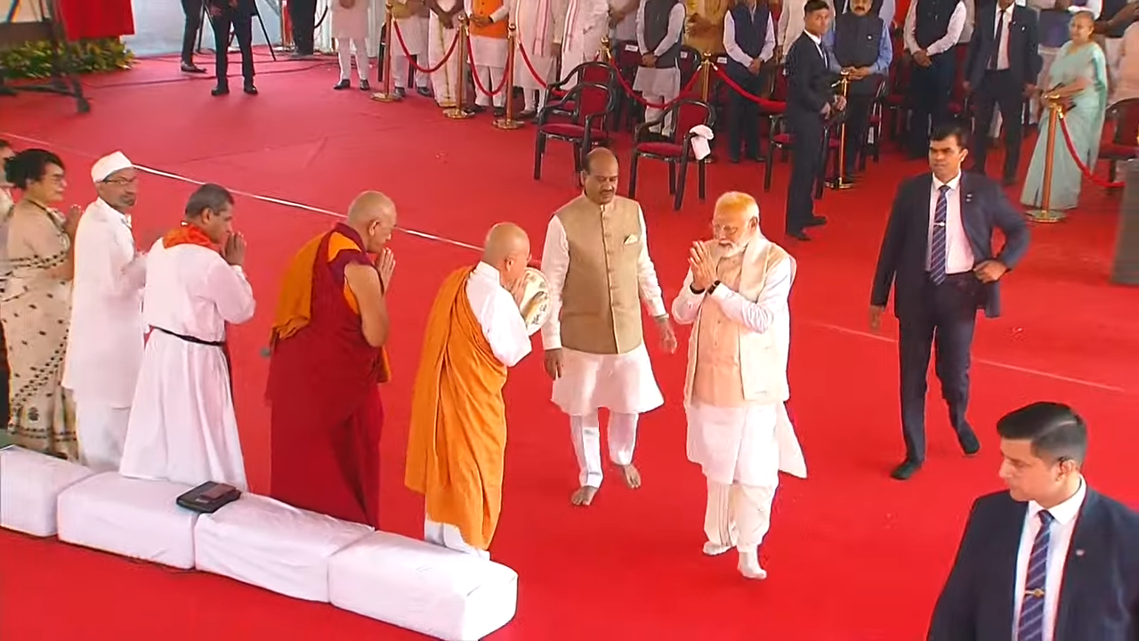 Indian Prime Minister Narendra Modi today inaugurated the new Parliament building amid a boycott by opposition parties, which insisted President Droupadi Murmu should do the honours.  He installed the historical sceptre ‘Sengol’ in the new Lok Sabha chamber and unveiled the inauguration plaque to mark the occasion with Lok Sabha Speaker Om Birla. They also participated in a pooja ceremony to bless the building. PM Modi then felicitated a group of construction workers involved in the making of the grand new parliament and was present for a multifaith prayer meeting with over 60 religious leaders invited to the event. The event is not without controversy, with 20 opposition political parties boycotting the ceremony.  Top wrestlers including Vinesh Phogat and Olympic medallists Bajrang Punia and Sakshi Malik, who have been staging a sit-in at Jantar Mantar in Delhi demanding Wrestling Federation of India (WFI) chief and BJP MP Brij Bhushan Singh's arrest for allegedly sexually harassing seven women grapplers, including a minor, hav announced they will hold a women's Mahapanchayat before the new Parliament building today. The new parliament building can comfortably seat 888 members in the Lok Sabha chamber and 300 in the Rajya Sabha chamber. For a joint sitting of both the houses, 1,280 MPs can be accommodated in the Lok Sabha chamber. The triangular-shaped four-storey building has a built-up area of 64,500 square metres. It has three main gates - Gyan Dwar, Shakti Dwar and Karma Dwar - and separate entrances for VIPs, MPs and visitors.  