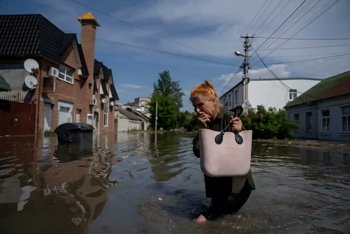 Local residents have been seen desperately trying to save their belongings or wading through flooded streets.