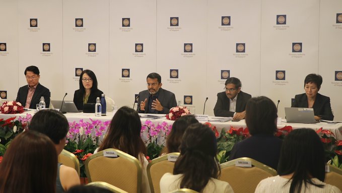 Talking to reporters at a press conference