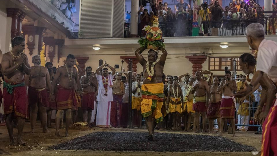 Indian-origin devotees walk barefoot on burning charcoal to mark Theemithi in Singapore