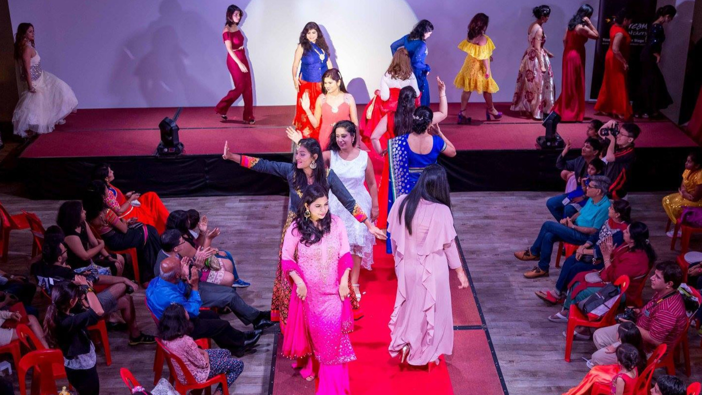 Three generations walk the ramp on the return of Runway Mom