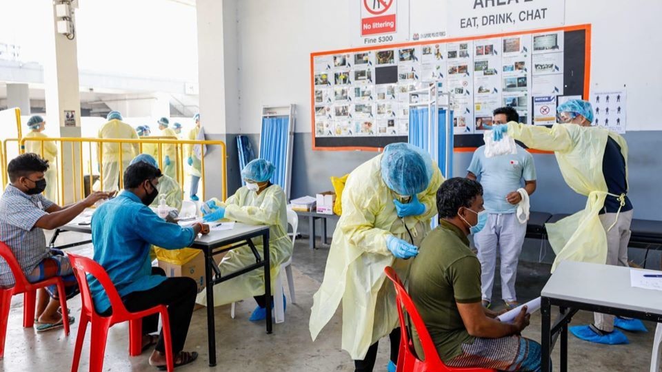 218 new COVID-19 cases on June 20, with 2 community cases comprising Work Permit holders