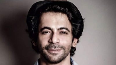 Comedian Sunil Grover waves to reporters, makes heart sign as he leaves hospital after heart surgery