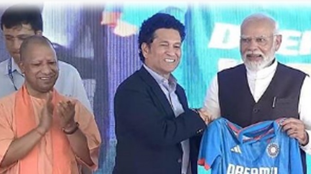 Varanasi stadium foundation ceremony: Indian cricket’s poster boy Sachin Tendulkar presents jersey to Narendra Modi with ‘NAMO’ written on it