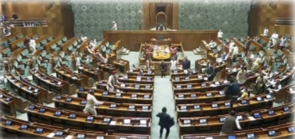 Security breached in Parliament on 2001 terror attack anniversary, two people enter Lower House, open smoke cannisters