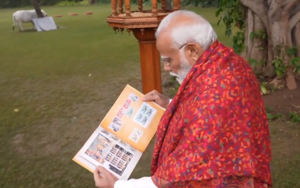 PM Narendra Modi with book of stamps on Ram