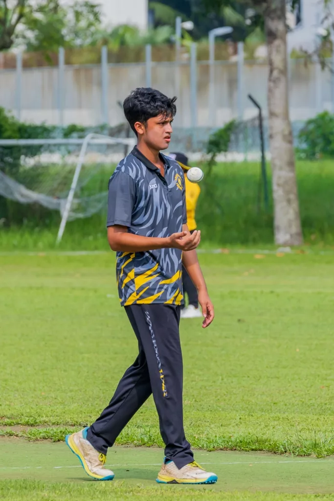 Young cricketer Ricky Sen walking back to his runup after bowling. Photo courtesy: TCC