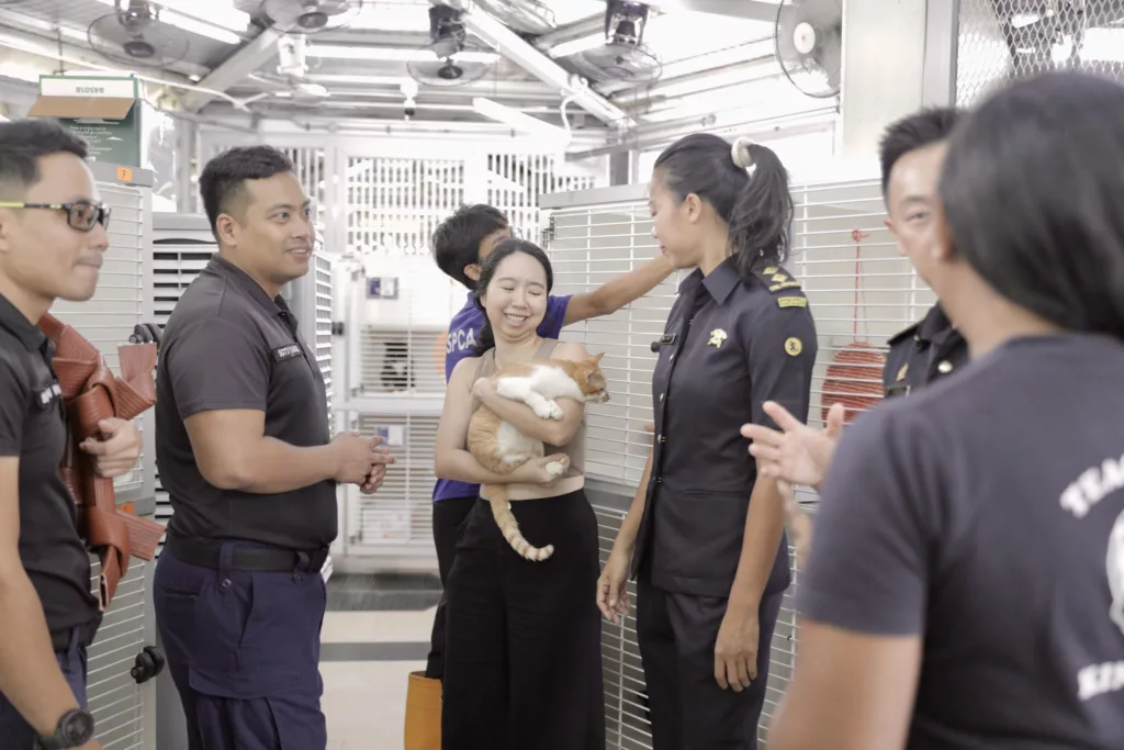 Singapore Civil Defence Force personnel with SPCA staff 
