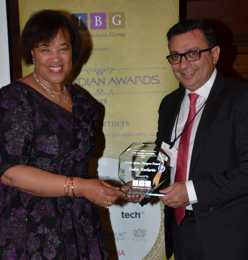 Zubin Karkaria gets an award in London