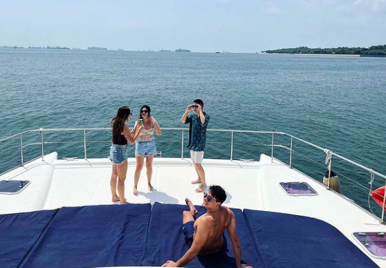 Joseph Schooling with friends on a boat