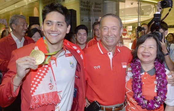 Joseph Schooling with his Olympic gold medal and parents Colin and May
