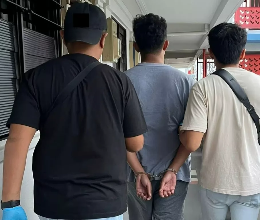 CNB officers arrested a suspected drug offender in an islandwide drug operation. Photo courtesy: CNB