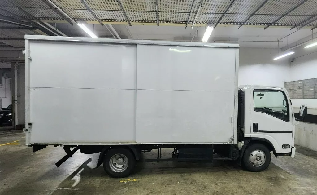 The lorry allegedly used to collect the consignment described as floor tiles but containing duty-unpaid cigarettes. Photo courtesy: Singapore Customs