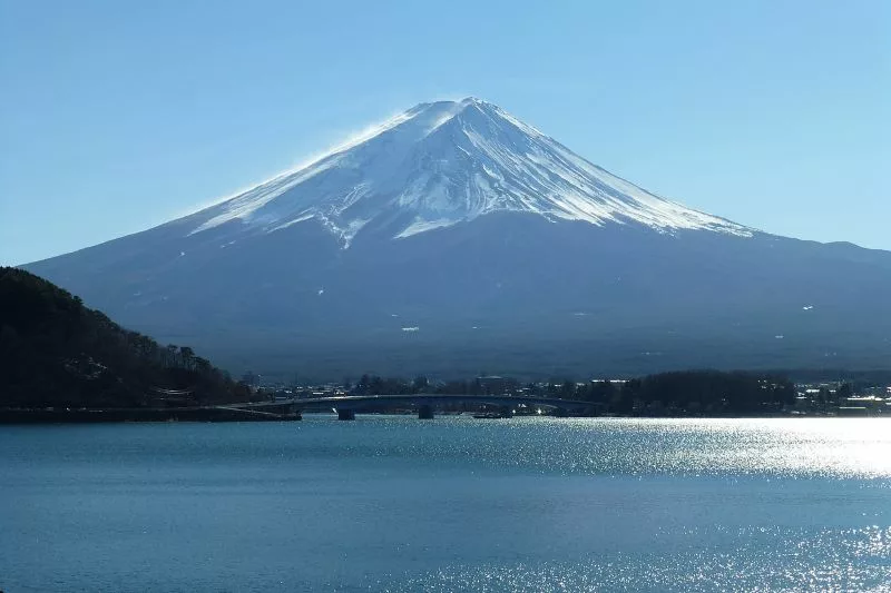 Japanese town puts up view-blocking barrier amid spike in tourist footfall to capture Mount Fuji