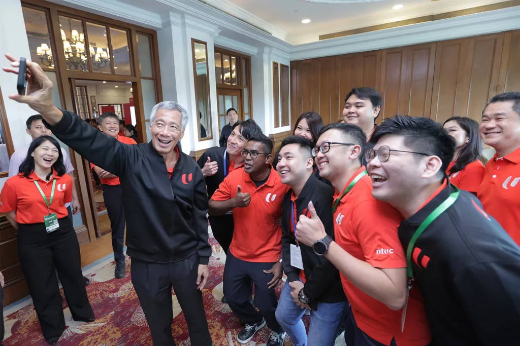 PM Lee with youth representatives in the Young NTUC committee