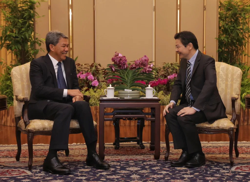 Singapore Prime Minister Lawrence Wong with Malaysian Foreign Minister Mohamad bin Haji Hasan