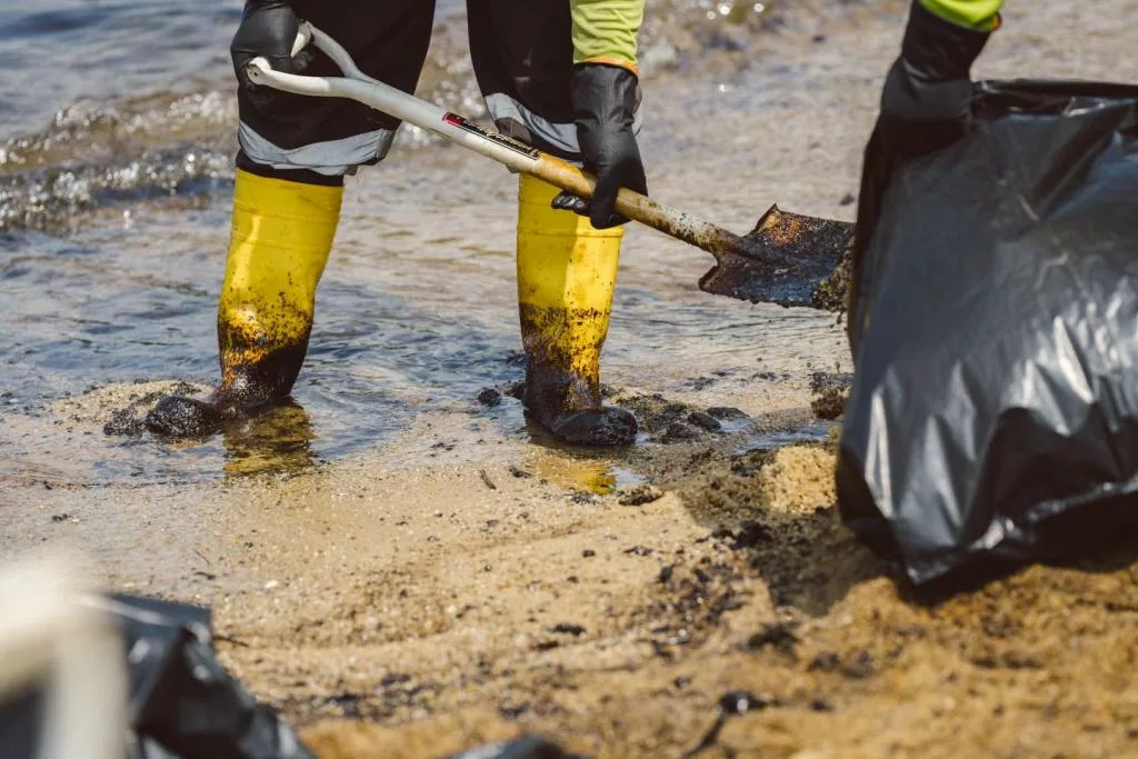 Singapore oil spill: Over 71,000kg of oil-soaked sand scooped up at the three Sentosa beaches, says minister; Malaysia starts coastal cleanup