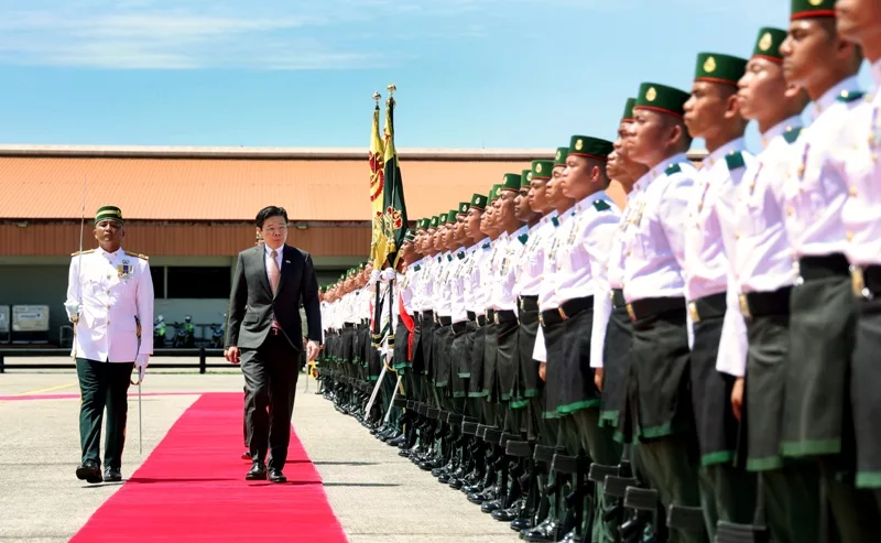PM Wong inspecting the Guard of Honour at the Brunei International Airport
