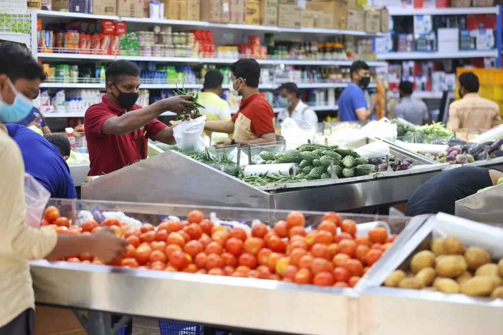 Migrant workers buying grocery in Singapore