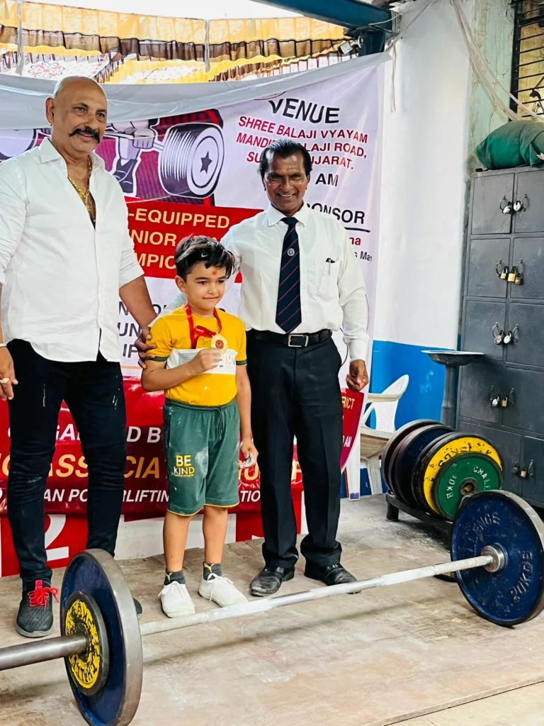 Yati posing with officials at a competition. Photo courtesy: Family