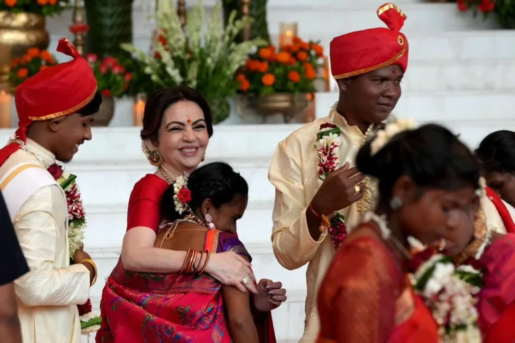 Nita Ambani embracing a new bride. Photo courtesy: Collected