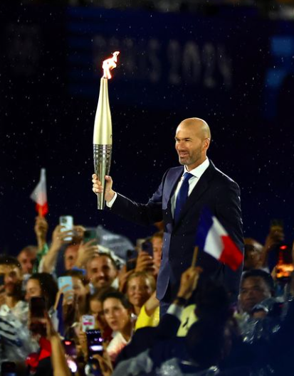 Zinedine Zidane with the Olympic flame at the Paris Olympics 2024 opening ceremony