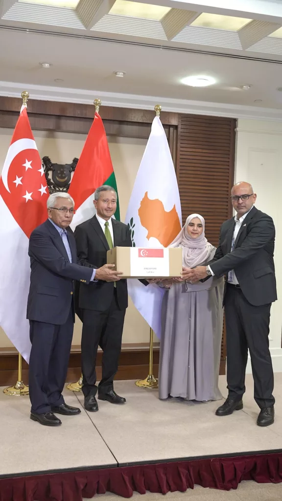 Minister for Foreign Affairs Dr Vivian Balakrishnan symbolically handed over a box of aid to Chargé d'Affaires at the United Arab Emirates (UAE) Embassy in Singapore Dhabia Al Mehairbi, and Honorary Consul of the Republic of Cyprus in Singapore Raja Bose at the handover ceremony. Singapore's Representative to the Palestinian Authority Hawazi Daipi was also present at the ceremony. Photo courtesy: Ministry of Foreign Affairs