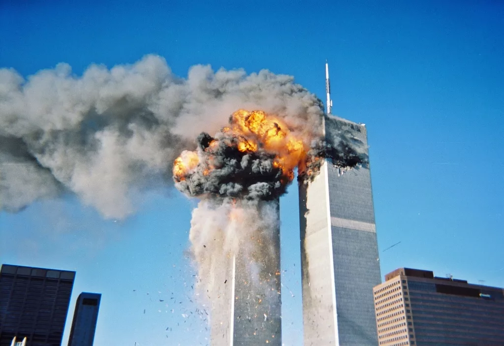 The World Trade Center in flames after being hit by one of the hijacked planes. Photo courtesy: rds323/Wikipedia