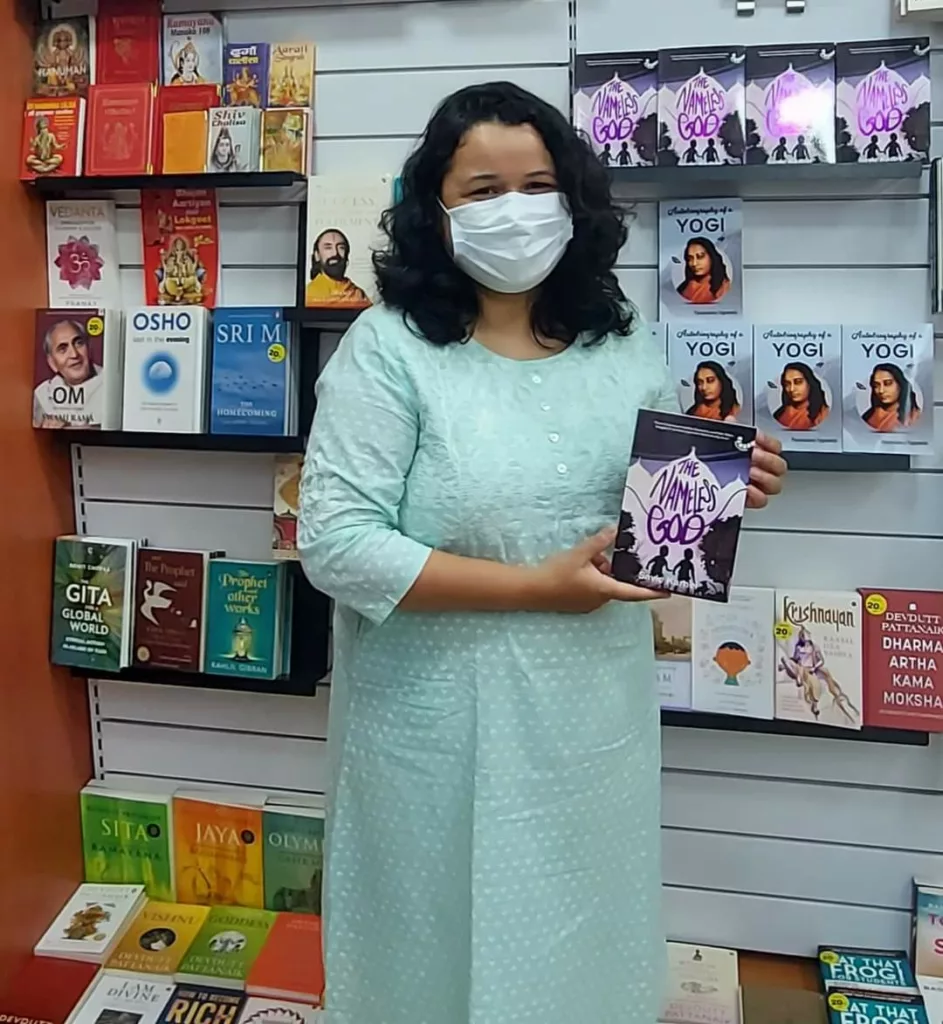 Savie Karnel with her first book, The Nameless God