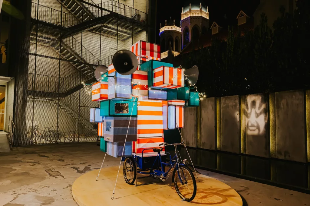 A projection will be activated when festival-goers pedal on the tricycle at Opera in Motion: A Dynamic Tribute to Chinese Opera