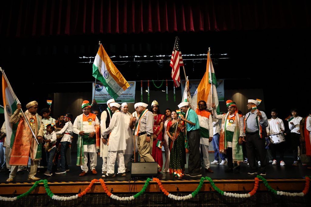 Flags of both India and the USA were waved as 3,000 American Indians attended the event. Photo courtesy: IAS