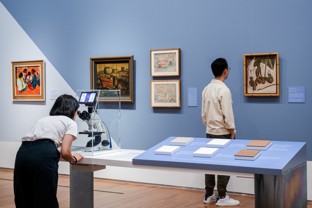 Visitors can use technology to view the paintings. Photo courtesy: National Gallery Singapore