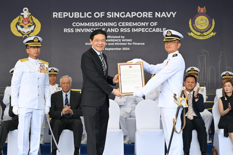 PM Wong presents Commissioning Warrant to CO of RSS Invincible