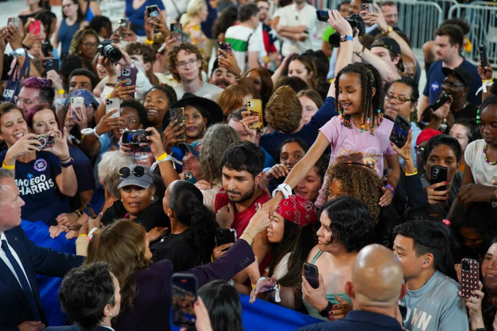 A child greets Kamala Harris at her Houston rally