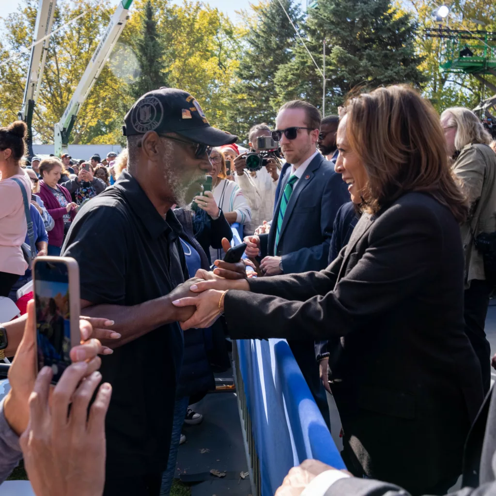 Kamala Harris greets a rally attendee in Houston, Texas