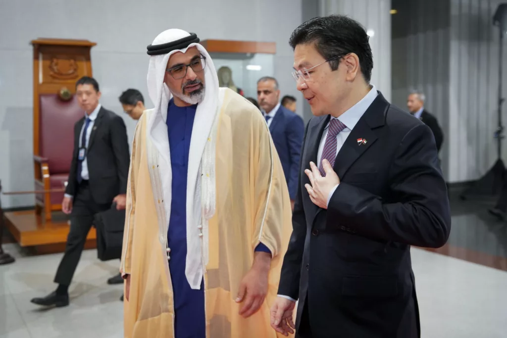 Sheikh Khaled bin Mohamed with Lawrence Wong